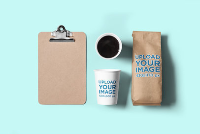 Mockup of a Coffee Cup and a Paper Bag Placed over a Flat Surface