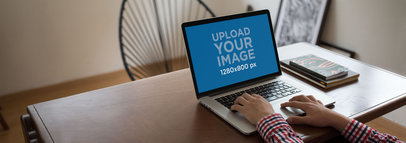 Guy Working on His MacBook Pro at Home Mockup