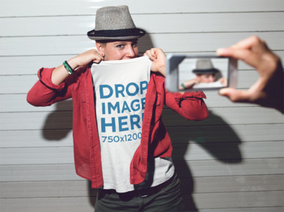 T-Shirt Mockup of a Trendy Woman Taking a Photo at Night