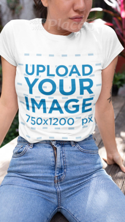 T-Shirt Video of a Woman Sitting on a Wooden Table