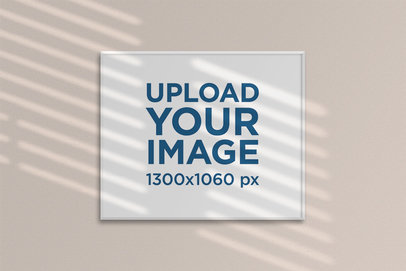 Mockup of a Framed Poster Hanging on a Wall 