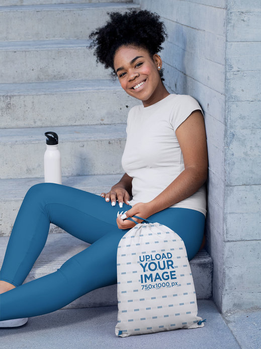 Drawstring Bag Mockup Featuring a Woman Ready for a Workout