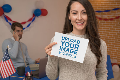 Mockup Featuring a Woman Holding an A5 Flyer at a Political Campaign Call Center 31925