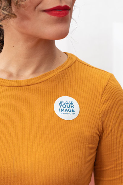 Mockup of a Woman Wearing a Sticker on Her Clothes