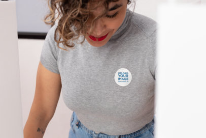 Mockup of a Woman with a Sticker on Her Blouse
