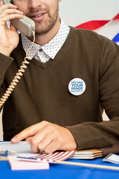 Button Mockup of a Man Talking on the Phone at a Political Polling Station