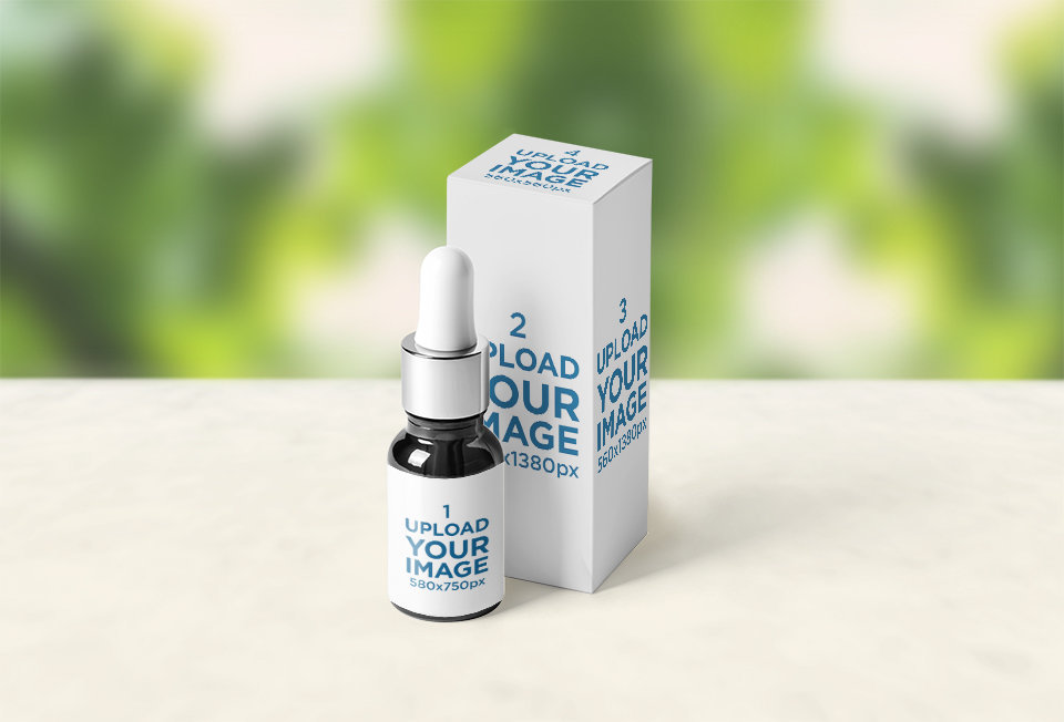 Angled View Mockup of a Dropper Bottle and a Box with a Blurry Background