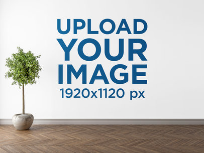 Mockup of a Wall Art Print with a Potted Plant on the Side 