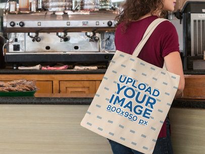 Tote Bag Mockup of a Woman at a Coffee Shop