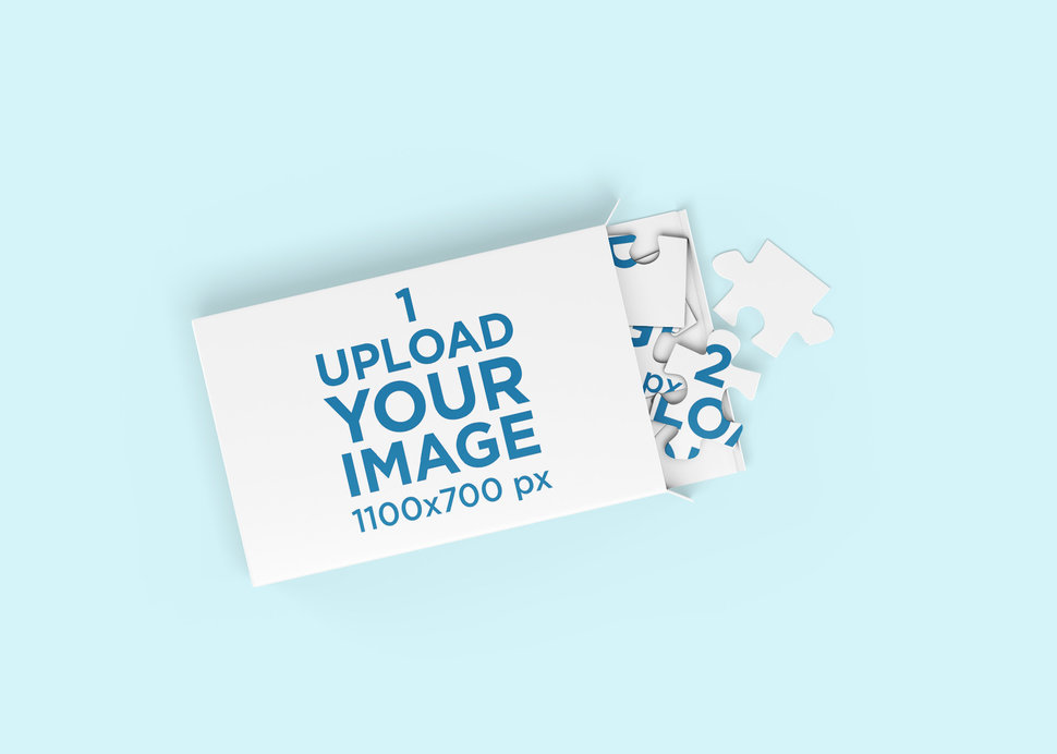 Mockup of a Puzzle and Its Packaging on a Plain Surface 