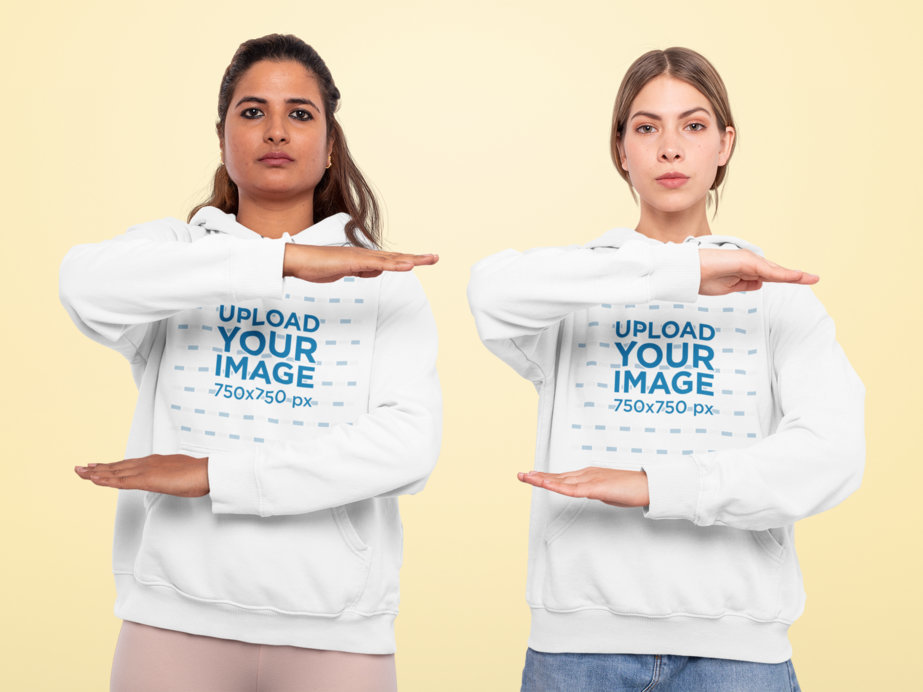 Pullover Hoodie Mockup Featuring Two Women Doing Equality Signs