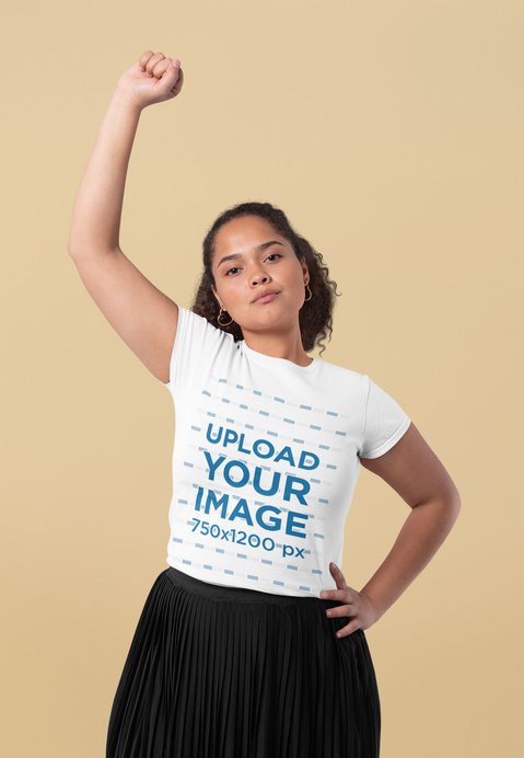 T-Shirt Mockup of a Young Woman Striking a Strong Pose