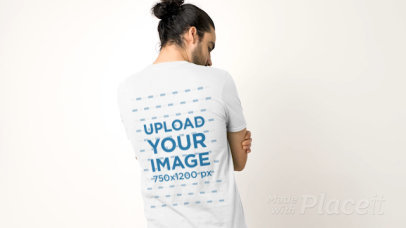 Video of a Tattooed Man Showing the Back of His T-Shirt to the Camera