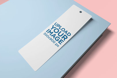 Mockup of a Bookmark on Top of a Color-Custom Book