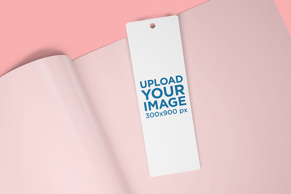 Mockup of a Bookmark Placed on an Open Magazine 