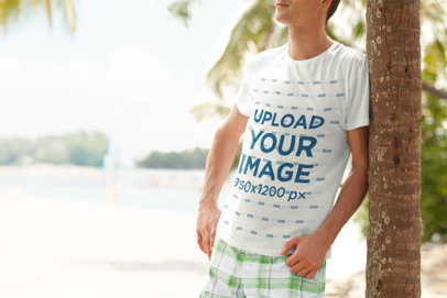  Crewneck T-Shirt Mockup of a Man Leaning on a Palm Tree