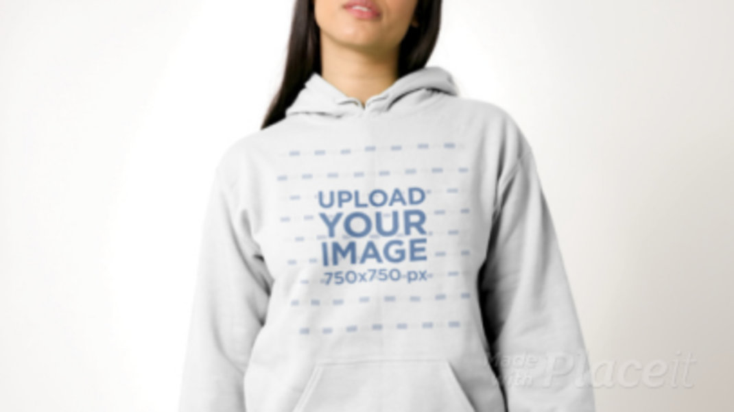 Video of a Woman Modeling a Hoodie in a Studio
