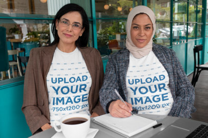 T-Shirt Mockup of Two Business Women at a Café 