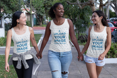 Tank Top Mockup of Three Women Walking Down the Street Holding Hands