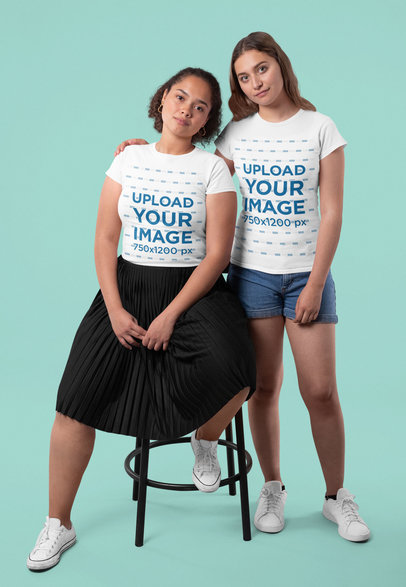 T-Shirt Mockup of Two Female Friends Hugging at a Studio