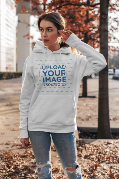 Pullover Hoodie Mockup Featuring a Woman by Some Dry Leaves 2825-el1