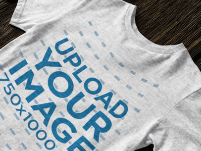 Heather T-Shirt Mockup Over a Wooden Table