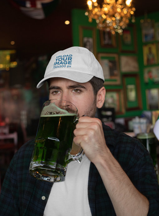 Mockup of a Man Wearing a Dad Hat While Drinking a Beer 