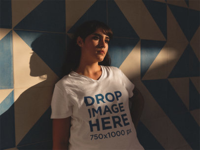 V-Neck Tee Mockup of a Hipster Woman Leaning Against a Wall