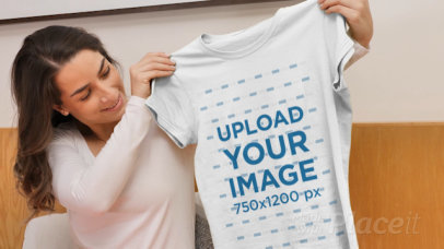 Video of a Woman Receiving a T-Shirt as a Present 
