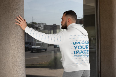 Back-View Mockup Featuring a Bearded Man Wearing a Hoodie with a Customizable Sleeve