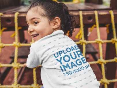 Child T-Shirt Mockup of a Little Girl Playing in the Park