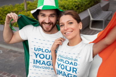 T-Shirt Mockup Featuring a Couple Holding an Irish Flag 