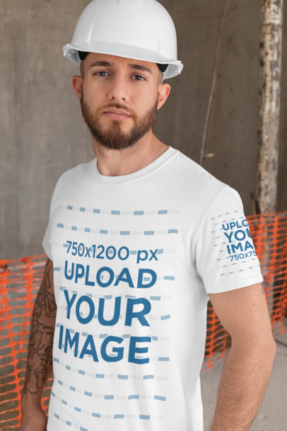 T-Shirt Mockup Featuring a Serious-Looking Man Wearing a Safety Helmet