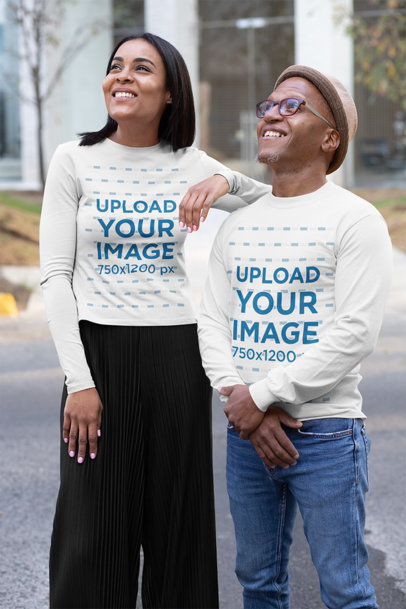Mockup of Two Friends Wearing Long Sleeve Tees on the Street