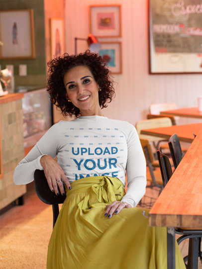 Mockup of a Woman Wearing a Long Sleeve Tee at a Restaurant 