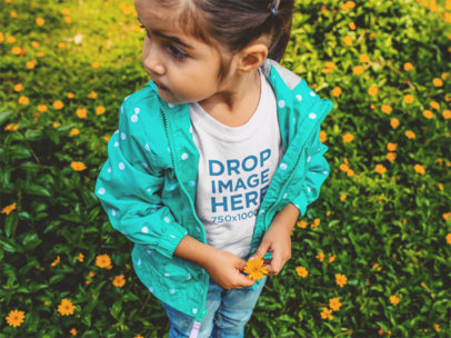 T-Shirt Mockup of a Little Girl Picking Flowers