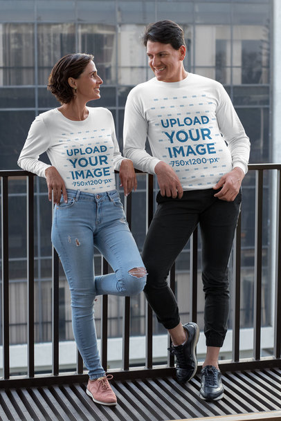 Long Sleeve T-Shirt Mockup of a Couple Talking in the Balcony