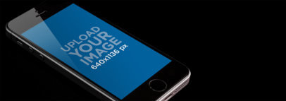 Mockup of an iPhone 5s in Portrait Position Against a Dark Background 