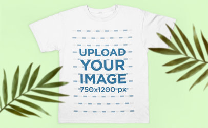 Mockup of a T-Shirt Laying Flat on a Surface with Some Plants