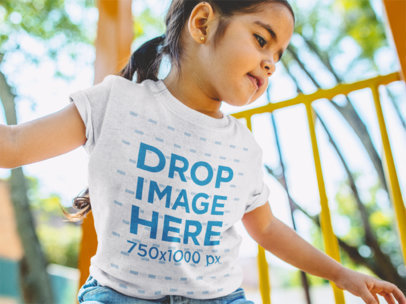Little Girl Playing at the Jungle Gym T-Shirt Mockup