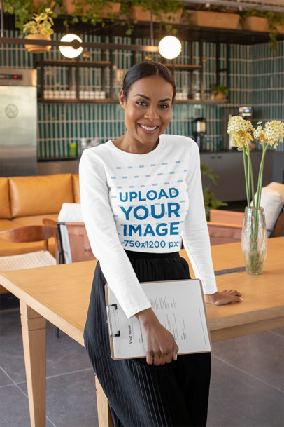 Mockup of a Middle-Aged Woman Wearing a Long Sleeve Tee at a Modern Office 