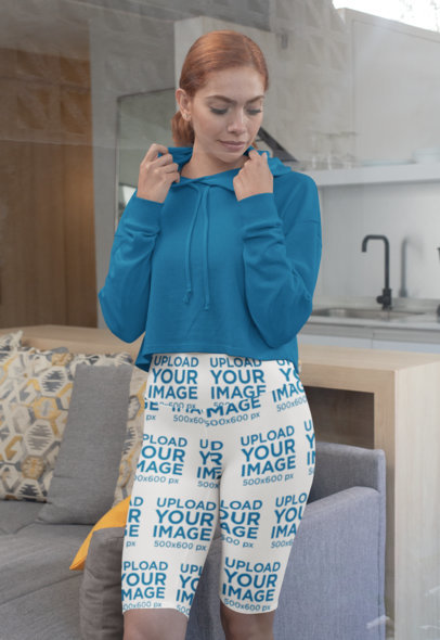 Sports Shorts Mockup Featuring a Woman at Home