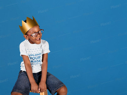 T-Shirt Mockup of a Kid With a Paper Crown