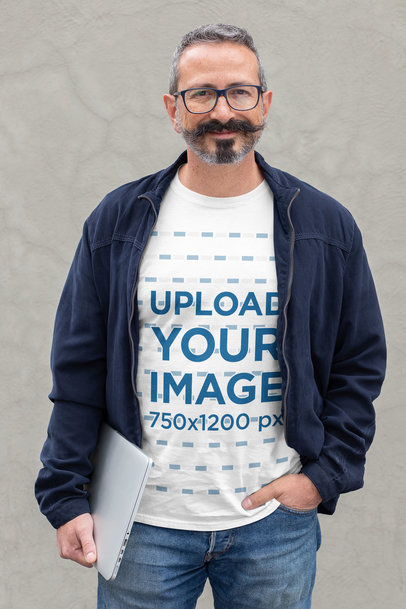 T-Shirt Mockup of a Slick Middle-Aged Man Holding a Laptop