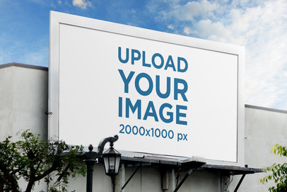 Billboard Mockup Featuring Blue Skies and a Street Lamp