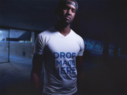V-Neck T-Shirt Mockup Featuring a Black Man Wearing a Snapback Hat