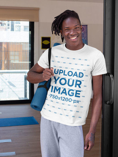 T-Shirt Mockup of a Smiling Man Carrying a Yoga Mat