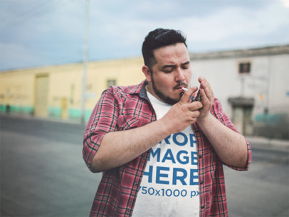 Plus Size Tee Mockup Featuring a Guy Lighting his Cigarette