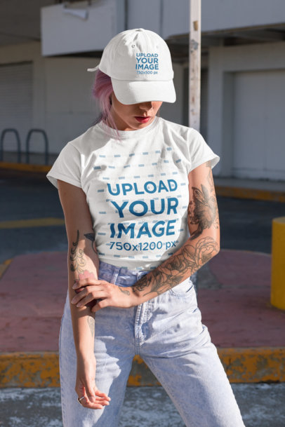 T-Shirt Mockup of a Woman Wearing a Dad Hat and Posing in the Street 