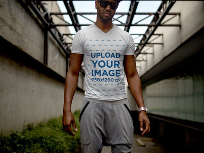 Urban T-Shirt Mockup Featuring a Young Man in the Dark